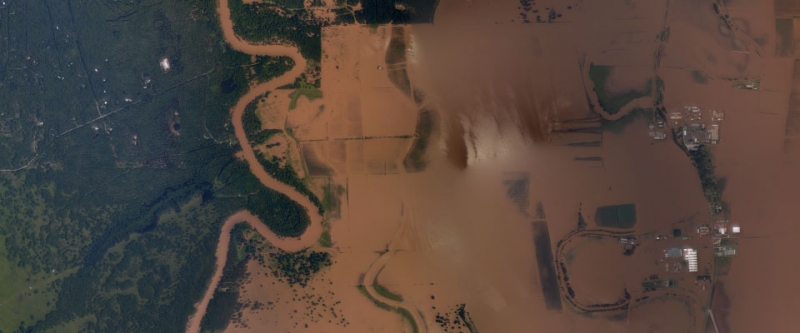 An aerial view of a flooded landscape. 