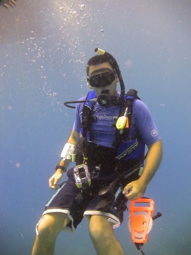 A man underwater in diving gear.