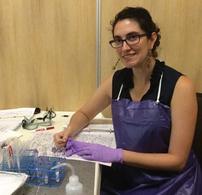 Woman scientist working at a lab bench.