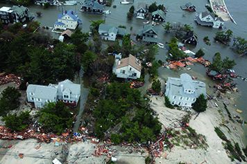 Aerial view of damaged homes on the coast.