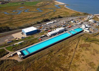 Aerial view of testing facility with long pool.