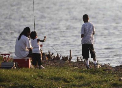 A family fishes on the Anacostia River near Washington, D.C.