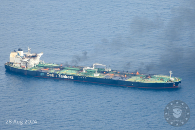 Aerial view of oil product tanker with fires onboard being towed in the Red Sea.