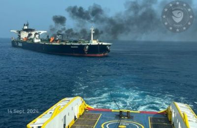 Salvage tug takes oil product tanker in tow.