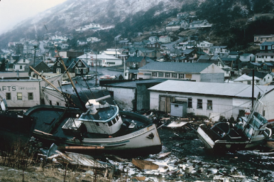 A scene of the chaotic condition of the commercial section of Kodiak following inundation by seismic sea waves.