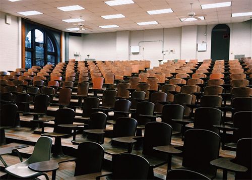 Auditorium with empty chairs.