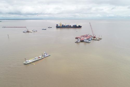 Aerial view of a bay with shipping vessels.