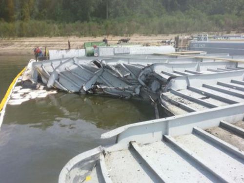 Close-up view of damaged barge.