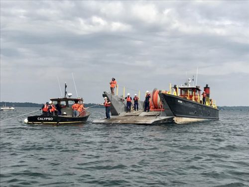 Activity involving two boats in a lake.