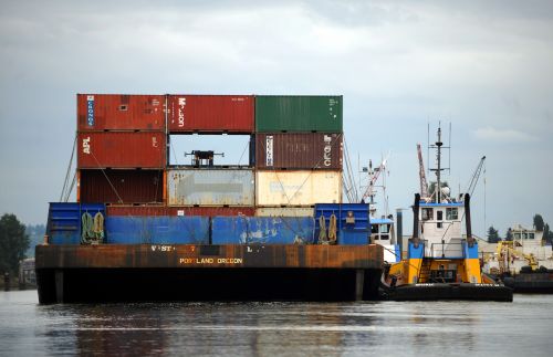 Barge and other vessels on the water.