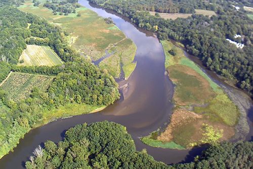 View of river and surrounding land.