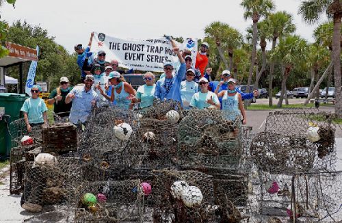 People posing with crab pots and debris.