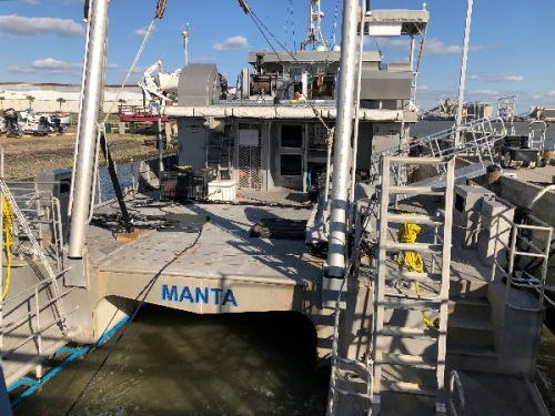 Marine vessel at a dock.