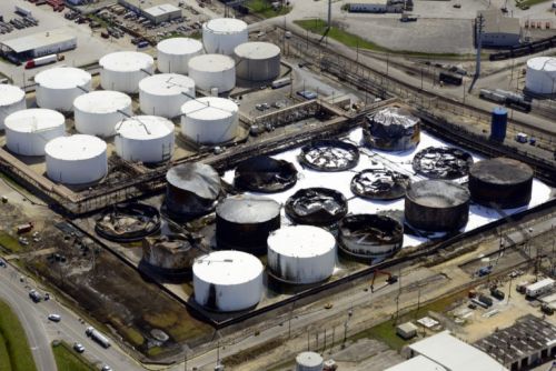 Aerial view of a damaged and burnt tank farm.