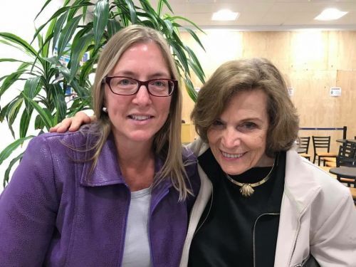 Two women posing for a photo. 