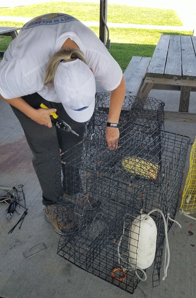 A person repairing a crab pot.