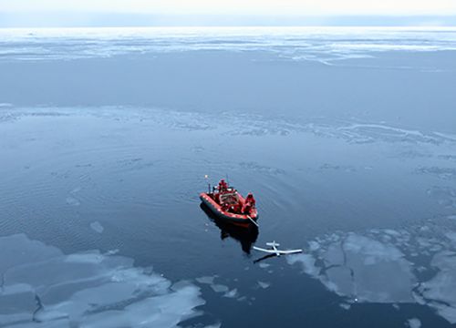 Vessel with small unmanned aircraft in the water.