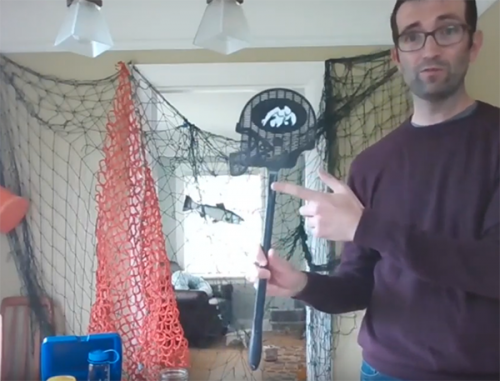 Man with marine debris exhibit.