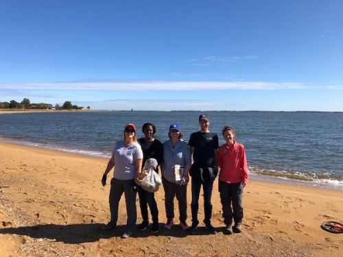 Group gathered on a beach.