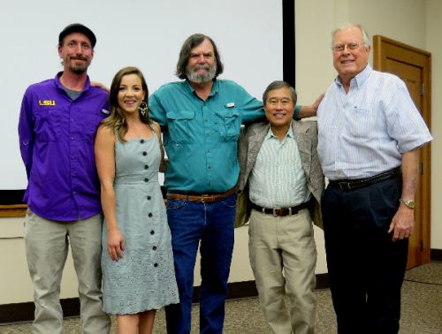 Five people posing for photo.