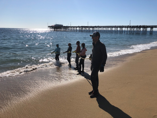 A group of people on a beach.