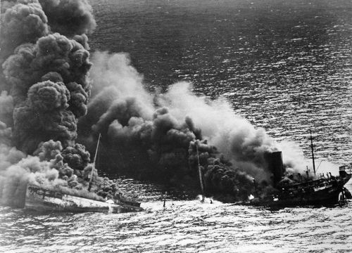 Smoke rises from a sinking tanker in the Atlantic Ocean.