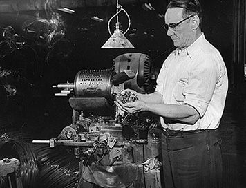 Atlas Tack Corporation became one of the nation’s largest manufacturers of wire tacks, bolts, shoe eyelets, bottle caps, and other small hardware. Unfortunately, these decades of production left a toxic legacy for Fairhaven's coastal marshes. January 17, 1955. (Spinner Publications/All rights reserved) Atlas Tack Corporation worker holding metal hardware produced in the factory.