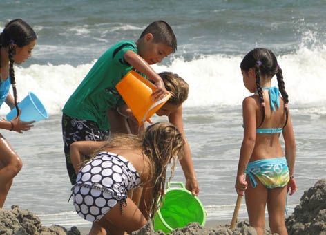 Kids play in the sand the same way they have for generations. (NOAA)