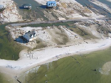 Damaged and flooded beachfront homes.