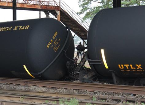 Derailed oil tanker cars up close.