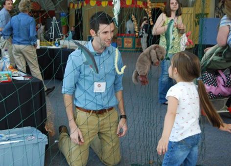 NOAA marine debris expert Peter Murphy teaches a child about trash in our ocean