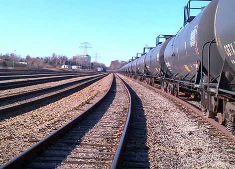 Oil tank cars with railroad tracks.