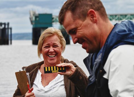 People laughing on beach field trip.