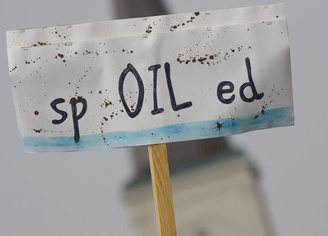 Protest sign reading 'spOILed.'