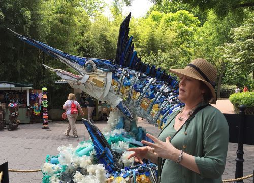 Washed Ashore's Angela Haseltine Pozzi with a giant marlin statue of ocean trash