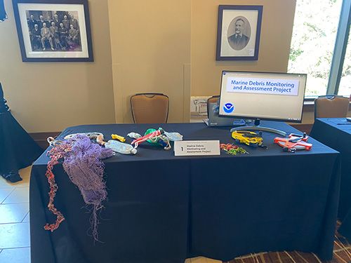 An educational display of the Marine Debris Monitoring and Assessment Project (MDMAP) for partners during the Tools Cafe (Credit: NOAA).