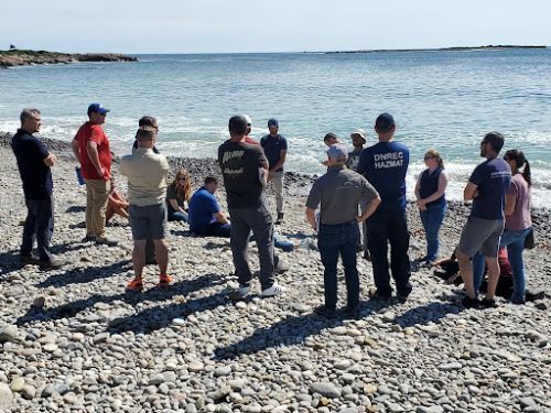 Participants engaged in a field exercise as part of a Science of Oil Spills class.