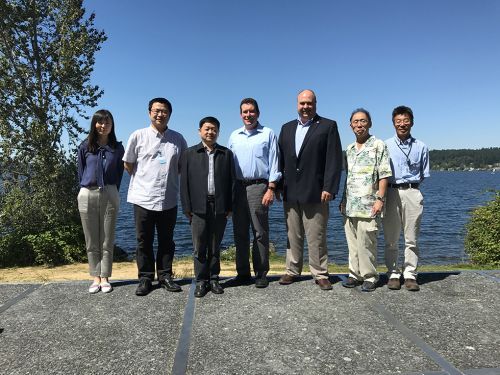 People standing together with lake in background. Image credit: NOAA.