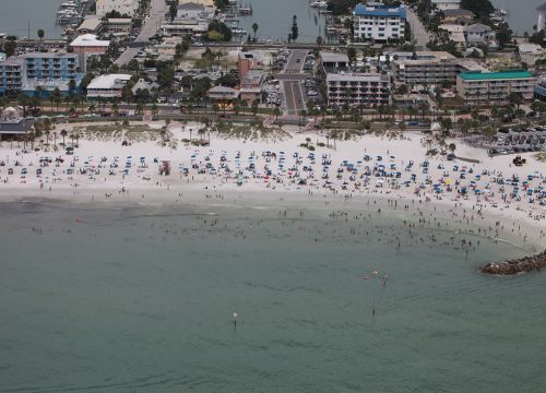 Beach with people and buildings. Image credit: NOAA.
