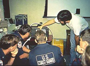 Photo: A NOAA instructor demonstrates the use of a fluorometer.