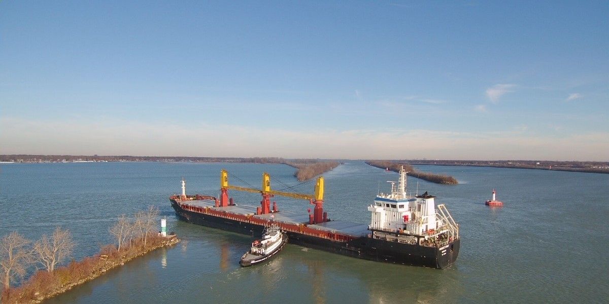 A bulk carrier aground in a river.