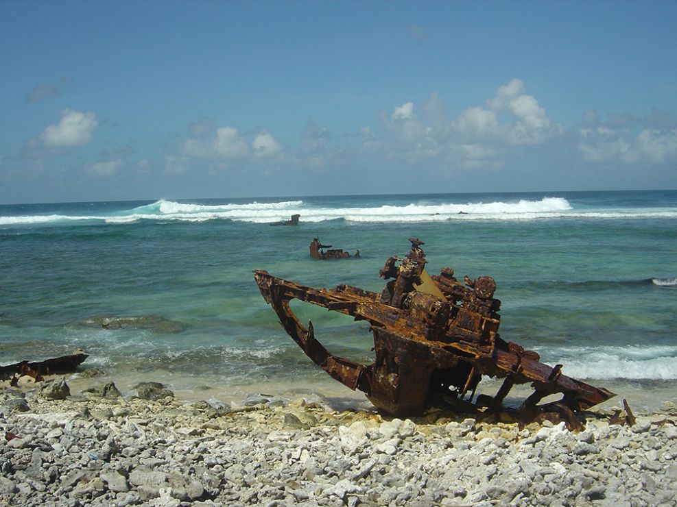 Rusted metal debris on a beach.