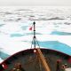Prow of a Coast Guard icebreaker in ice-filled Arctic waters.