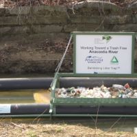 Example of a floating trash boom installed on a river. 