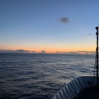 View of sunset at sea from a vessel.