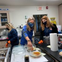 Three women working in a lab.
