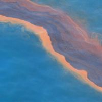 A heavy band of oil is visible on the surface of the Gulf of Mexico.