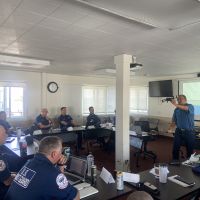 Flight instructor, Dr. Oscar Garcia-Pineda, leads ground school for UAS training team consisting of USCG UAS pilots and representatives from OR&R, USCG, and the Couvillion Group (Image Credit: NOAA). 