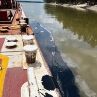 Oil alongside barge in Mississippi River observed on June 11, 2023