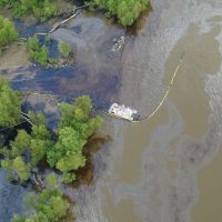 Aerial photo of Mississippi River near New Orleans, Louisiana, with oiling from Barge DM932 Oil Spill. Image credit: NOAA.